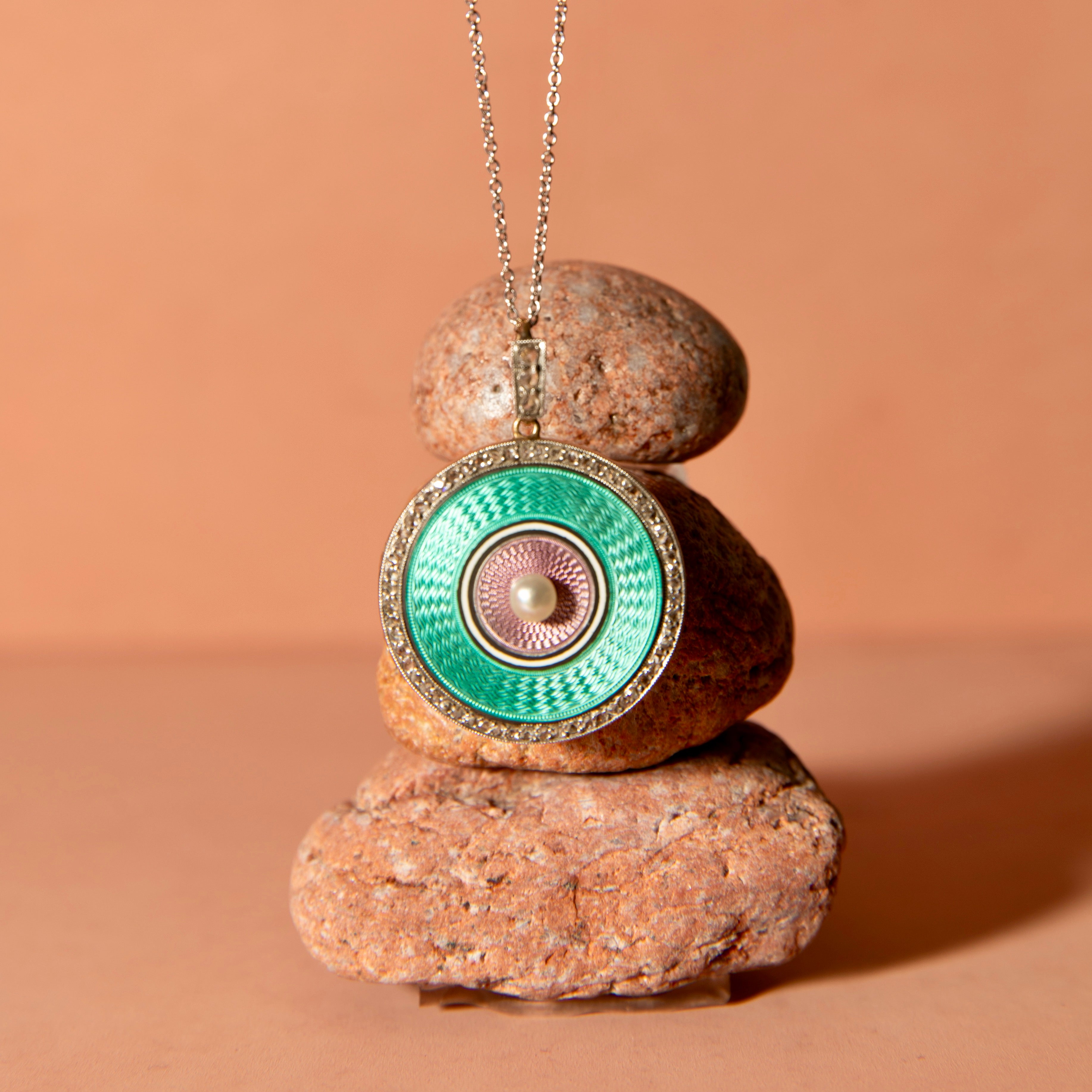 Early 20th Century Guilloche, Diamond, Pearl, Platinum, and 14K Gold Locket