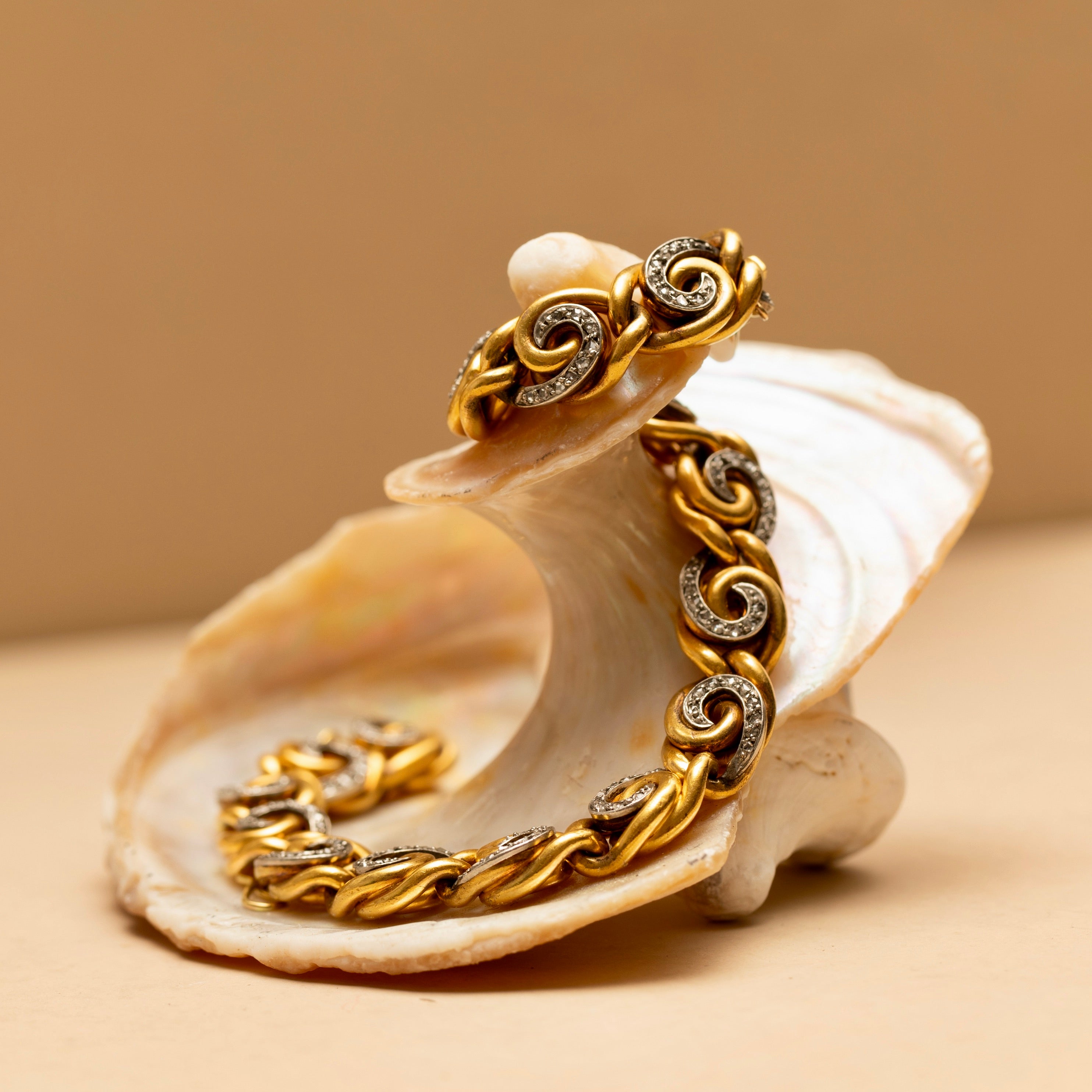 French 18K Gold and Diamond Swirl Link Bracelet