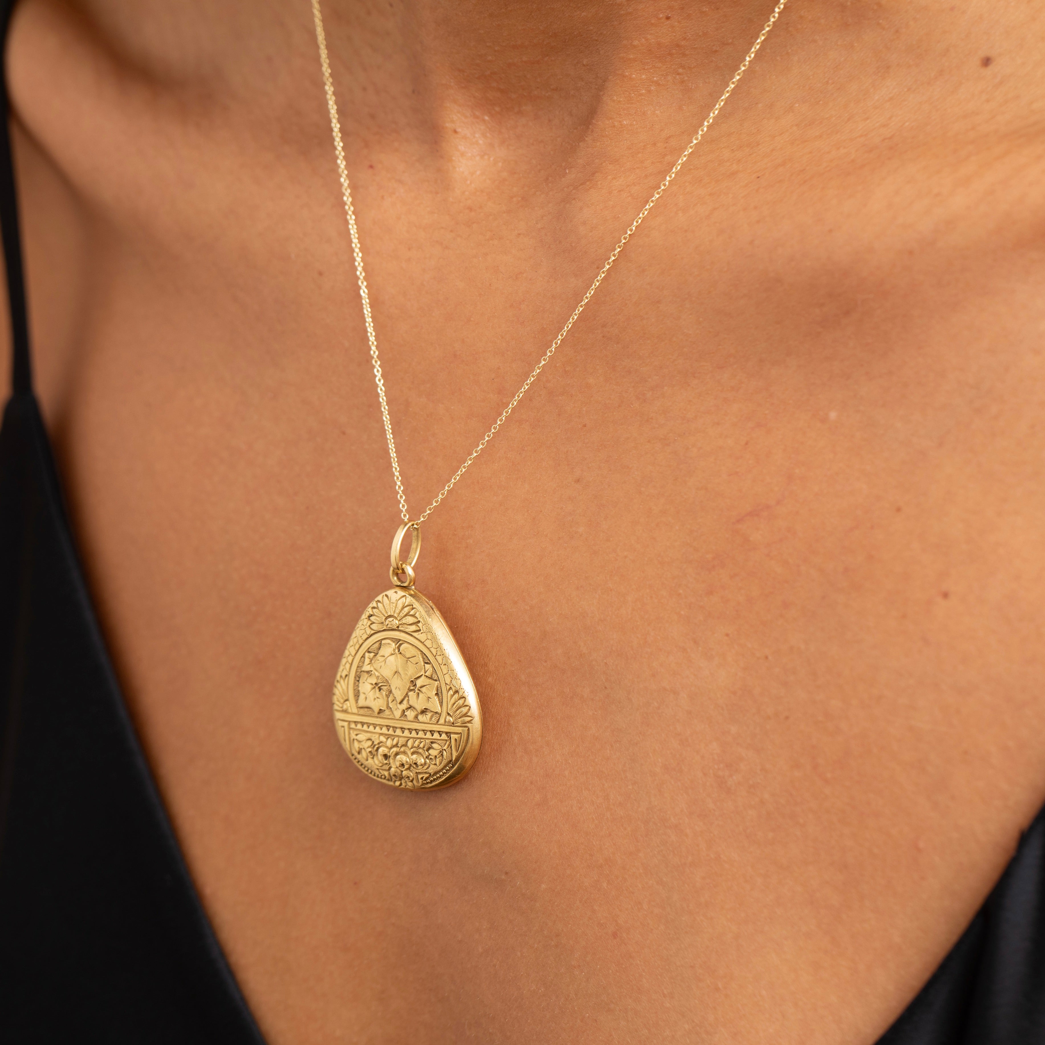 Early 20th Century Floral Embossed 14K Gold Locket Necklace