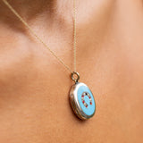 English Victorian Enamel, Pearl, Garnet, and 9k Gold Horseshoe Locket