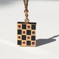 Victorian Ruby, Enamel, and 14k Gold Checkerboard Locket