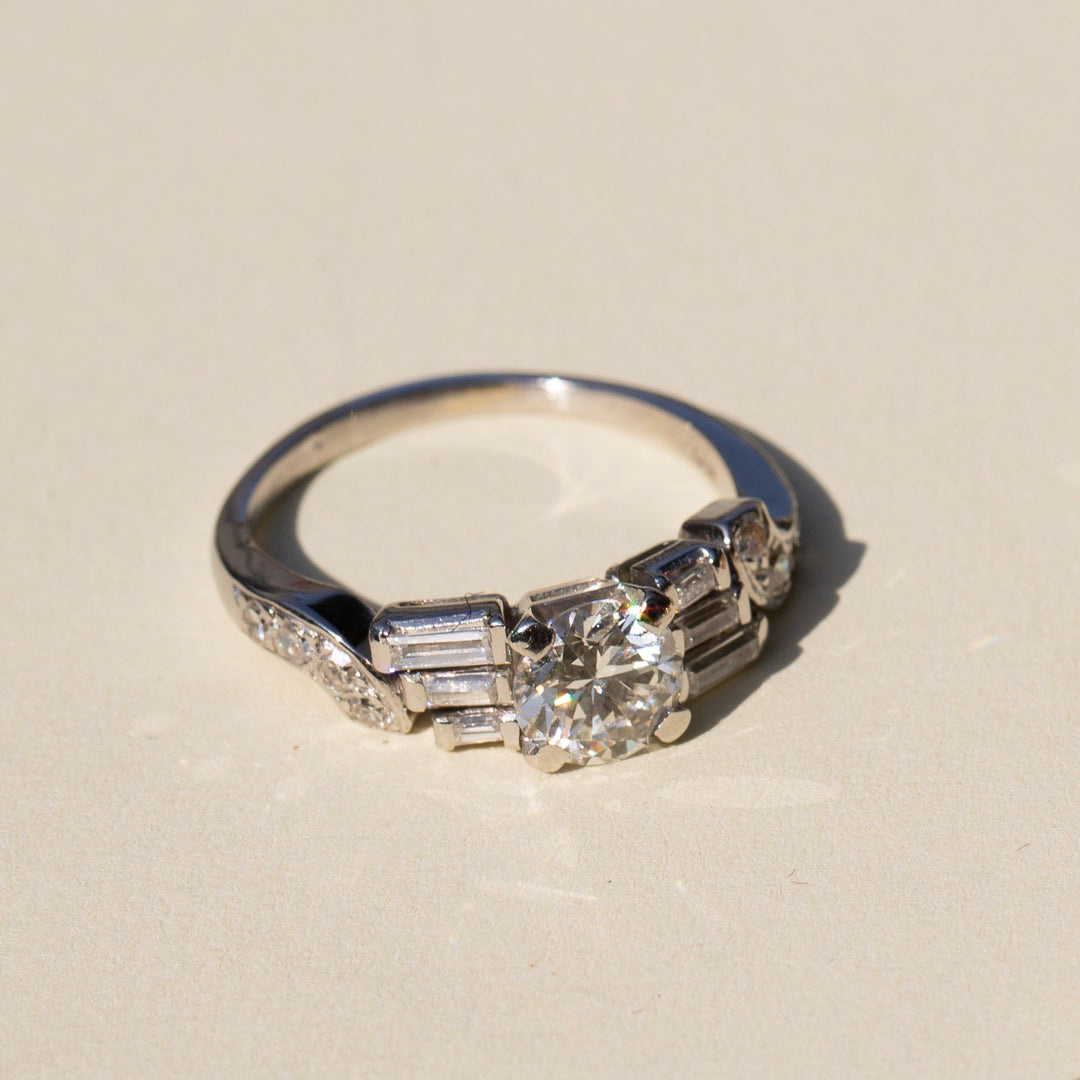 Diamond and Platinum Ring With Baguette And Single Cut Accents