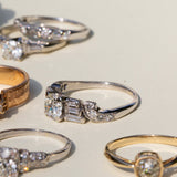 Diamond and Platinum Ring With Baguette And Single Cut Accents