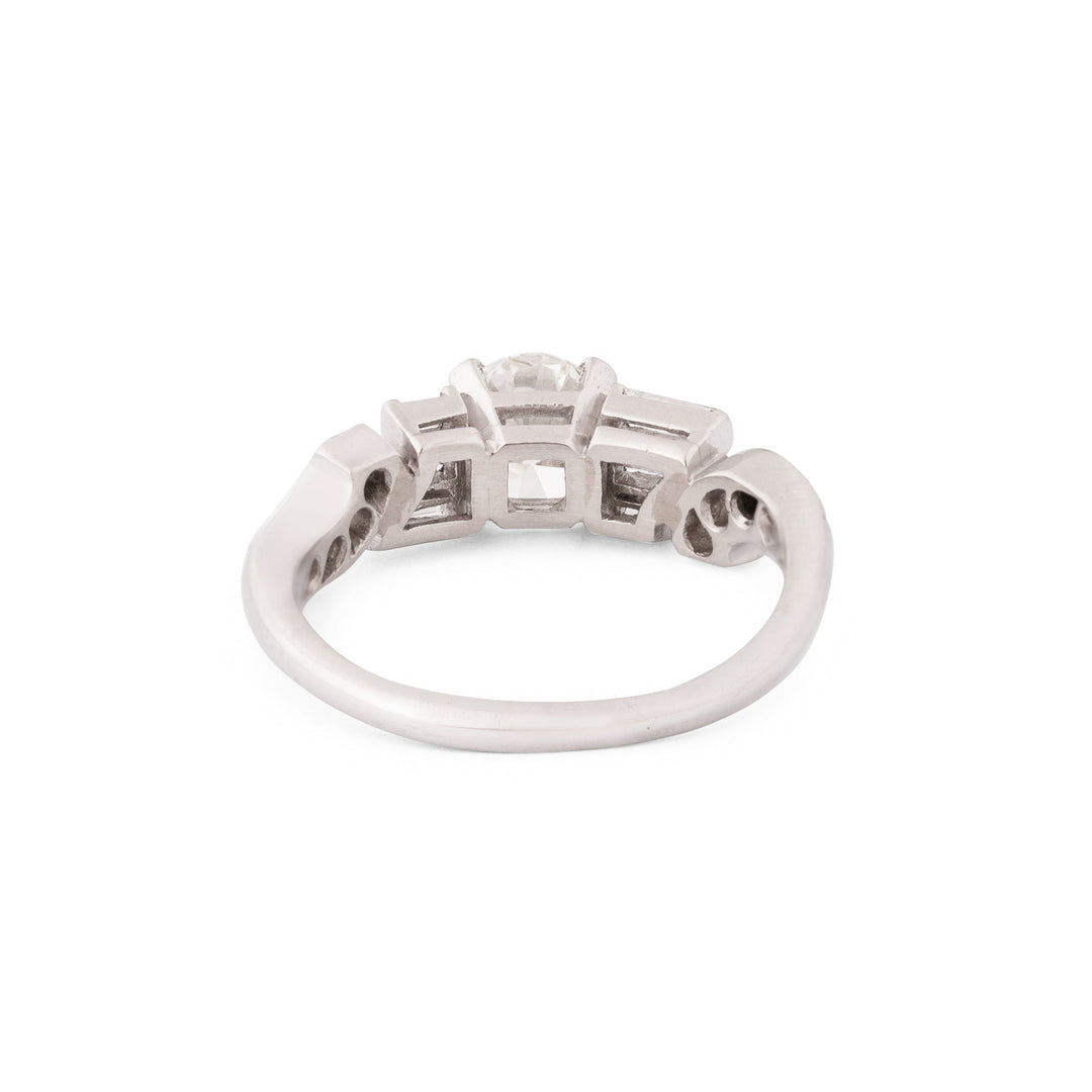 Diamond and Platinum Ring With Baguette And Single Cut Accents