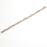 Edwardian Old Cut Diamond, Platinum, and 18k Gold Link Bracelet