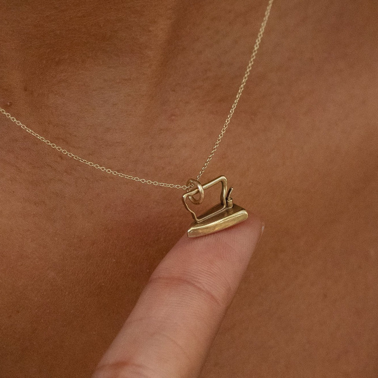 Iron 10k Gold Charm
