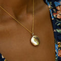 Accordion Folding 9k Gold Round Locket