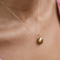Movable 18k Gold and Pearl Shell Charm